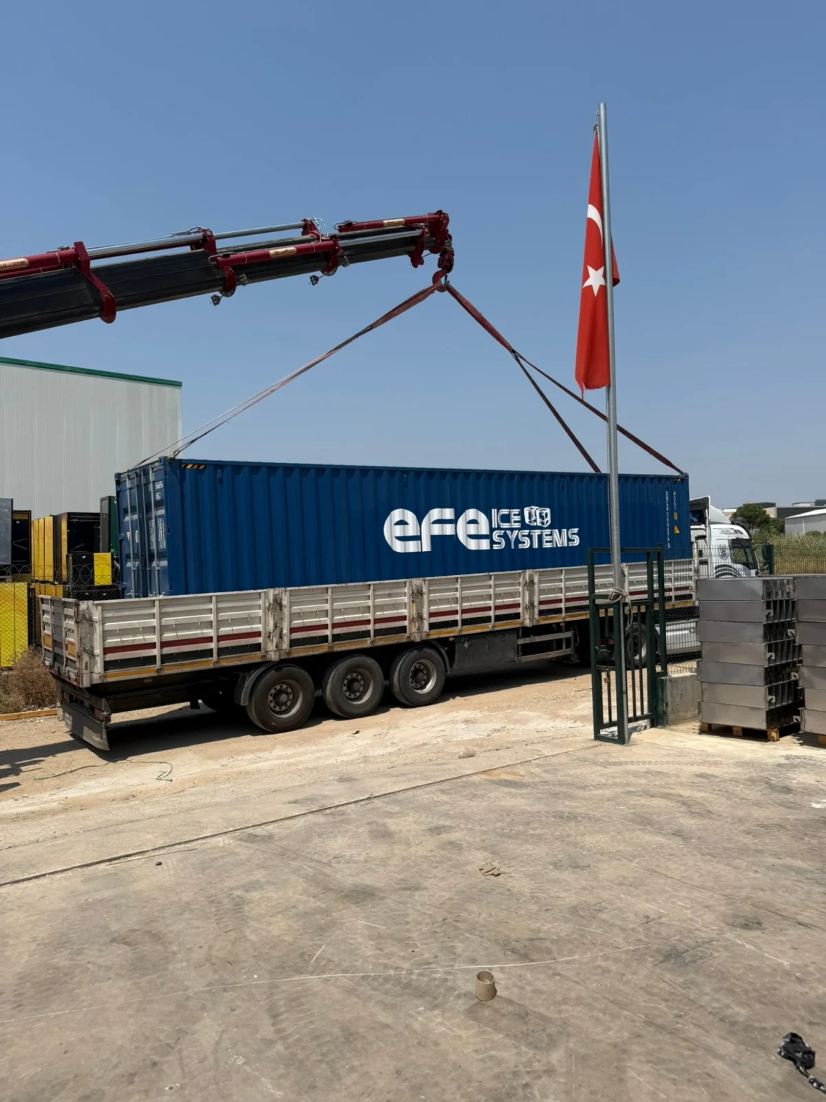EFE Ice Systems containerised ice machine being loaded onto a truck for shipment to Erbil