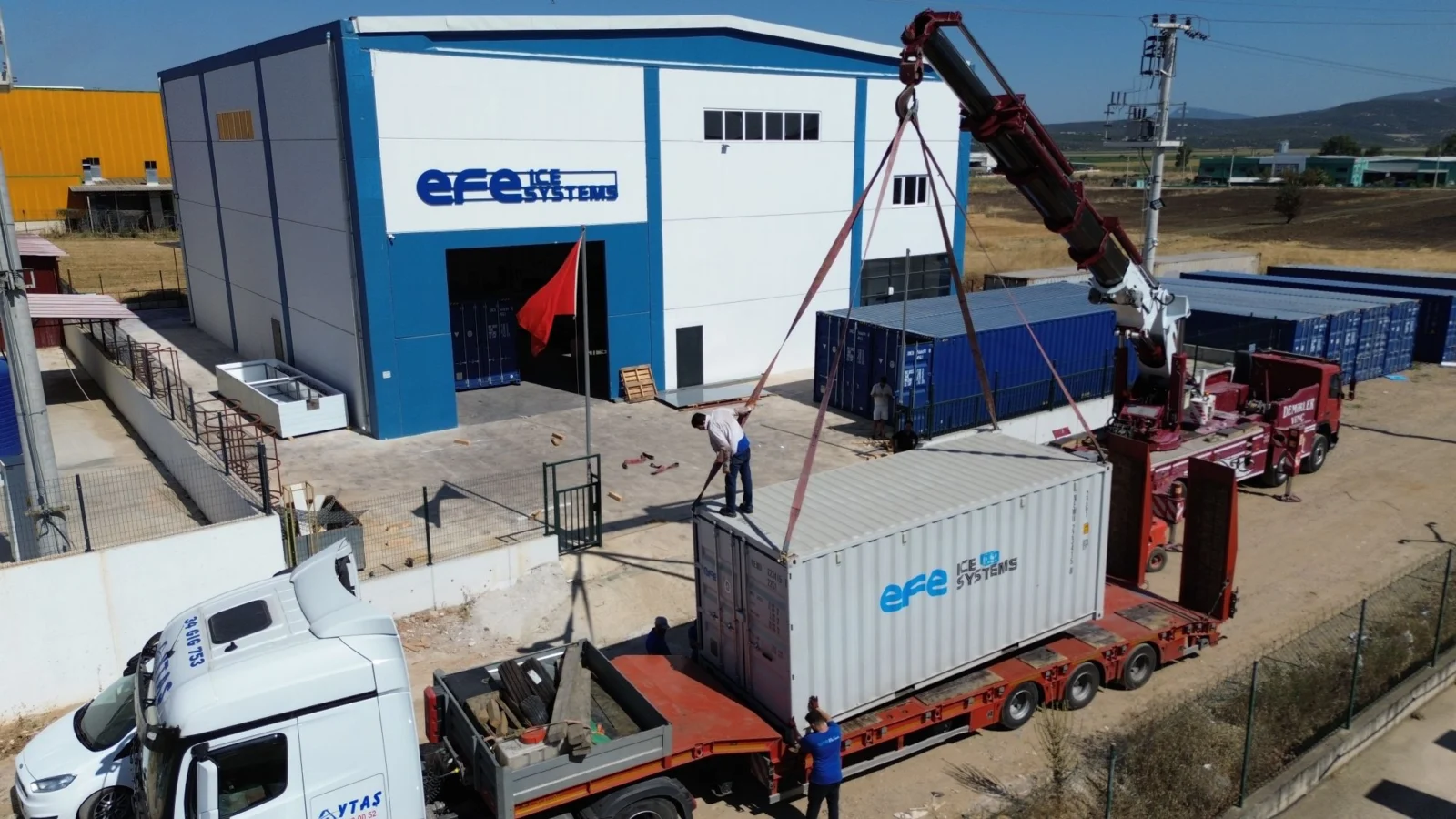 EFE Ice Systems containerised ice machine being craned onto a truck for Trinidad and Tobago