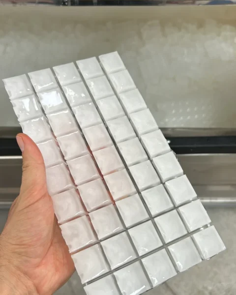 Fresh sheet of cube ice straight from the machine